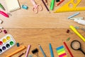 School supplies on wooden table, background with frame made of stationery. Education, studying and back to school concept. Child Royalty Free Stock Photo