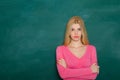 School teacher in class on blackboard background. Professional portrait. Royalty Free Stock Photo