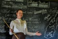 School Teacher in Front of Blackboard