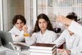 School teacher gives chemistry lesson to children in a laboratory with flasks with liquids for experiments. Education