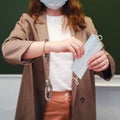 School teacher with handcuffs on his hand, concept of non-freedom during quarantine. Education during the coronavirus epidemic