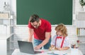 School teacher with a schoolboy learning at laptop computer, studying with online education e-learning. Teacher and Royalty Free Stock Photo