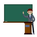 School teacher stands near blackboard. Royalty Free Stock Photo