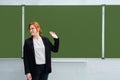 School teacher waves his hand against the blackboard, copy space. The concept of leaving school, completing lessons, or being