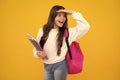 School teenage girl with book and copybook. Teenager schoolgirl student, isolated background. Learning and knowledge. Go Royalty Free Stock Photo