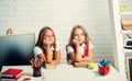 School time of girls. Back to school and home schooling. Little girls eat apple at lunch break. Friendship of small Royalty Free Stock Photo