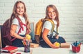 School time of girls. Friendship of small sisters in classroom at knowledge day. Back to school and home schooling