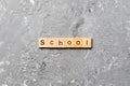 School word written on wood block. school text on cement table for your desing, concept