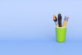 School writing accessories in cup in cartoon style.