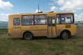 School yellow bus with the inscription on its side -Children - stands on the grass against the beautiful sky Royalty Free Stock Photo