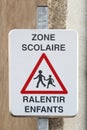 School zone slow down children road sign in French language Royalty Free Stock Photo