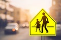 School zone warning sign on blur traffic road with colorful bokeh light abstract background Royalty Free Stock Photo