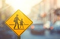 School zone warning sign on blur traffic road with colorful bokeh light abstract background Royalty Free Stock Photo