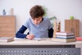 Schoolboy with abacus studying math at home