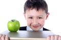 Schoolboy with book and apple Royalty Free Stock Photo