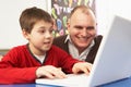 Schoolboy In IT Class Using Computer With Teacher Royalty Free Stock Photo