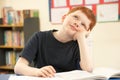 Schoolboy Daydreaming In Classroom Royalty Free Stock Photo