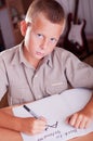 Schoolboy doing his homework Royalty Free Stock Photo