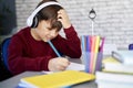 Frustrated schoolboy doing homework at home Royalty Free Stock Photo