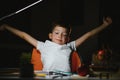 Schoolboy doing homework at the table in his room Royalty Free Stock Photo