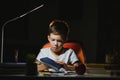 Schoolboy doing homework at the table in his room Royalty Free Stock Photo