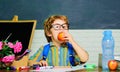 Schoolboy eating apple. Healthy school breakfast for child. Fruit snack. Lunch time. Royalty Free Stock Photo