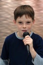 Schoolboy giving a performance and entertains the people