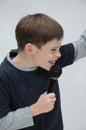 Schoolboy giving a performance and entertains the people