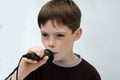 Schoolboy giving a performance and entertains the people Royalty Free Stock Photo