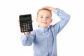 Schoolboy holding calculator. Portrait of funny cute 10s boy touching his head with hand.White background