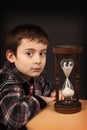 Schoolboy with hour-glass Royalty Free Stock Photo