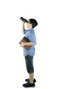 Schoolboy looking at something with a binocular