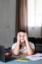 Schoolboy looking tired and bored of doing homework. Copy space Royalty Free Stock Photo