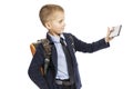 Schoolboy makes selfie, close-up, isolated on white background