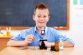 Schoolboy with microscope