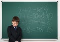 Schoolboy near the school board math solve Royalty Free Stock Photo