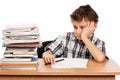 Schoolboy overwhelmed by books Royalty Free Stock Photo
