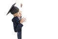 Schoolboy peeking out from behind white board. Space for text. Boy in school uniform, big glasses and student hat. Copy space Royalty Free Stock Photo