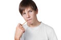 Schoolboy with a pencil in his mouth Royalty Free Stock Photo