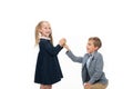 Schoolboy presenting apple to girl Royalty Free Stock Photo