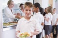 Schoolboy in a school cafeteria Royalty Free Stock Photo