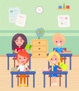 Schoolboy and Schoolgirl Sitting by Desk at Lesson Royalty Free Stock Photo