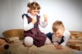 A schoolboy and schoolgirl in uniform having fight, argument, fun and rest in the room. A boy and girl during fun photo Royalty Free Stock Photo