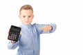 Schoolboy shows at calculator. Portrait of funny cute 10s boy .White background