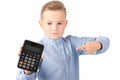 Schoolboy shows at calculator. Portrait of funny cute 10s boy .White background Royalty Free Stock Photo