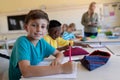 Schoolboy sitting at a desk in an elementary school classroom Royalty Free Stock Photo