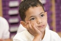 Schoolboy sitting in primary class