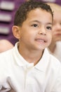 Schoolboy sitting in primary class Royalty Free Stock Photo