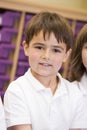 Schoolboy sitting in primary class Royalty Free Stock Photo