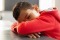 Schoolboy sleeping at desk in a classroom Royalty Free Stock Photo